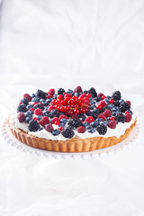 Tart with berries and whipped cream.