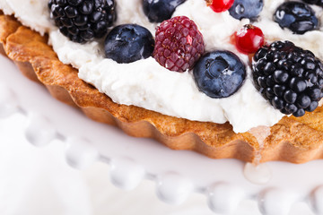 Tart with berries and whipped cream.