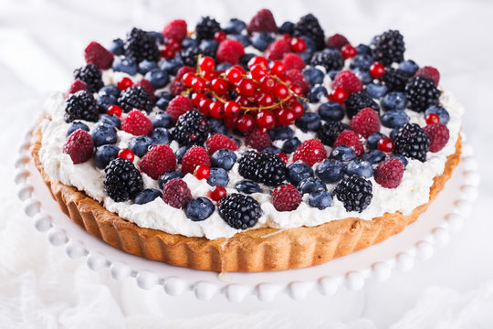 Tart with berries and whipped cream.