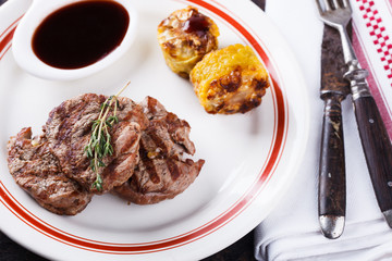 Pieces of red meat, steaks with vegetable and spices.selective focus