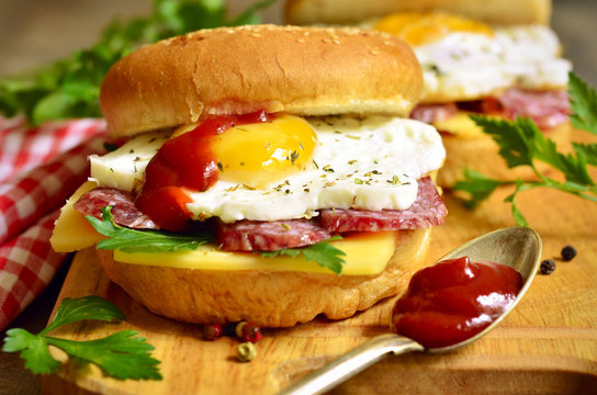 Burger with cheese,salami and fried egg.