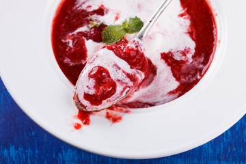 Strawberry soup with ice cream.