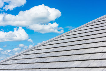 Fototapeta na wymiar roof tiles with blue sky background