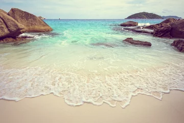 Papier Peint photo Lavable Plage tropicale Vintage style beautiful nature of blue sea sand and white waves on small beach near the rocks during summer at Koh Miang island in Mu Ko Similan National Park, Phang Nga province, Thailand