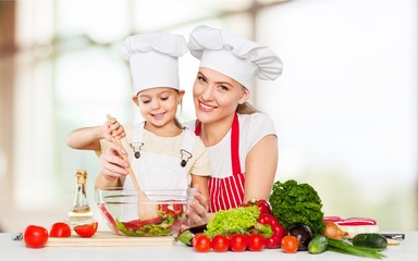 Mother and daughter cooking.