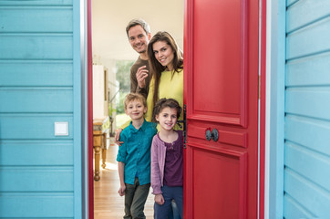 family is opening their stylish red door to welcome the guest