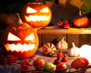 Halloween pumpkins on wooden table background