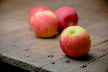 cold apples on wooden table