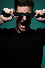 Young man in black shirt.