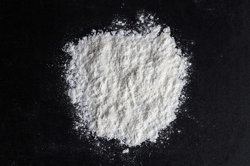 Spilled White Baking Flour on Black Background