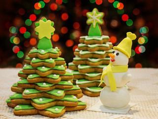 Homemade sweets - Gingerbread Christmas tree and a snowman from sugar mastic