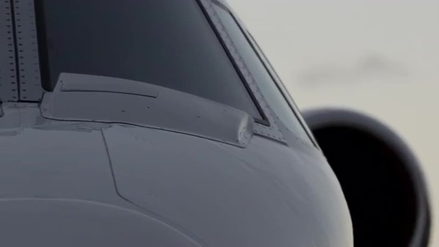 Close up front panning shot of Cessna Citation private jet (parked)
