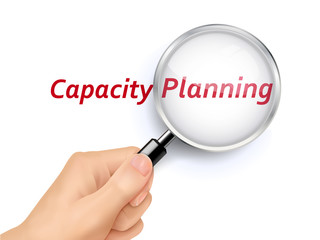 capacity planning words showing through magnifying glass