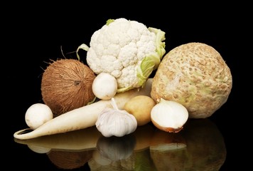 White dietetic vegetables-coconut,onion,selery on black © T. Wejkszo