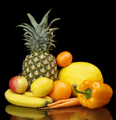 Set of yellow fruits-mandarin,orange,citrus,bananas on black at the bottom