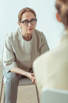 Psychotherapist talking with patient