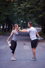 jogging couple stretching