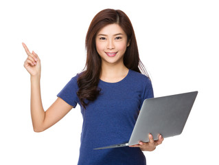 Woman hold with laptop computer and finger point up