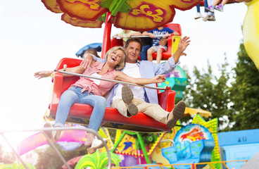 Fototapeta na wymiar Senior couple in amusement park
