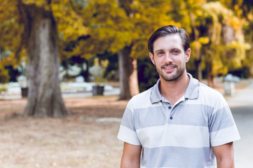 Young man outdoors portrait with copy space