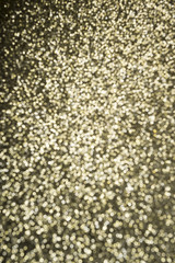 Gold glitter background in defocus abstract