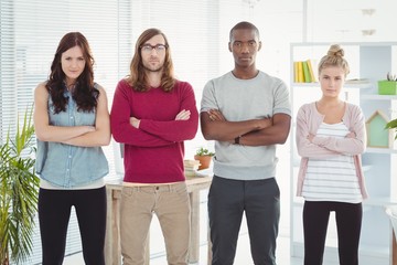 Portrait of business team standing with arms crossed