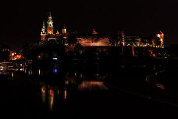 Fototapeta na wymiar Krakow at night. Wawel Castle and Wisla.
