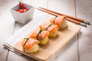 homemade sushi with potatoes and fresh salmon