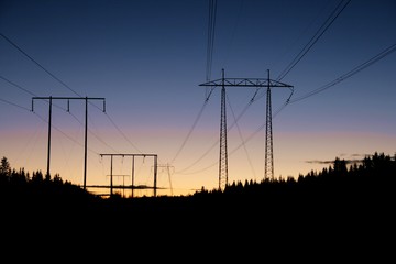 High voltage masts in sunset