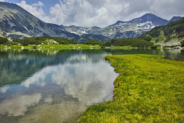 Fototapeta na wymiar Reflection of Banderishki chukar peak in Muratovo lake, Pirin Mountain, Bulgaria