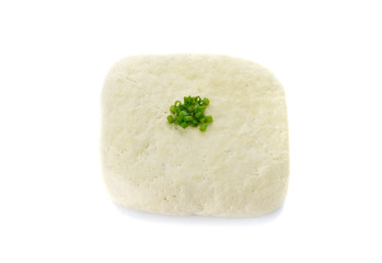 white tofu on with spring onion on white background