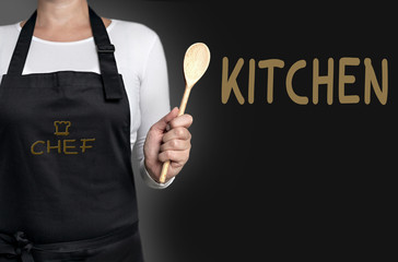 kitchen cook holding wooden spoon background concept