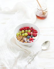Healthy breakfast. Bowl of oat granola with yogurt, fresh
