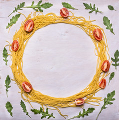 ingredients raw pasta cherry tomatoes arugula lined frame on wooden rustic background top view space for text