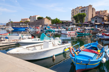Fototapeta na wymiar Small wooden fishing boats moored in Ajaccio
