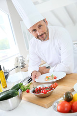 Closeup of smiling cook in kitchen