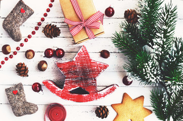 Xmas decoration with red wooden star, valenki, gingerbread cooki