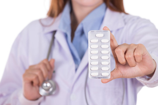 close up pills with female doctor