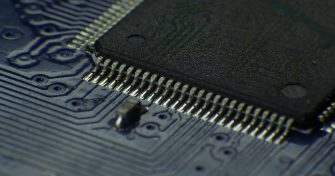 Macro shot on technology circuit board  rotating with CG and VFX . 4K 