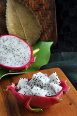 fresh dragon fruit on wooden board