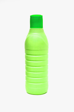 Green plastic bottles on white background