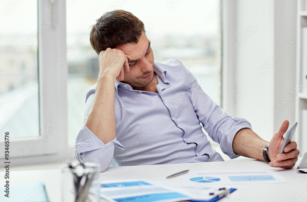 Poster businessman with smartphone at office