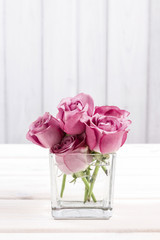 Bouquet of pink roses in glass vase