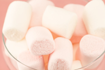 Fototapeta na wymiar sweet marshmallows on a pink background