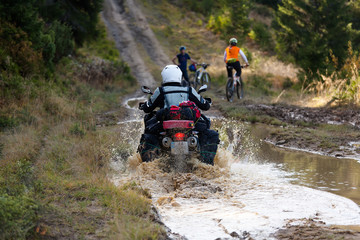 Motorbiker in autumn forest