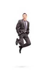 Joyful businessman jumping out of happiness