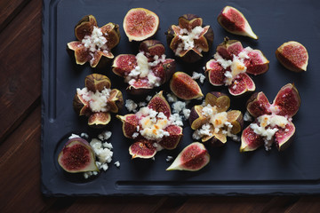 Obraz na płótnie Canvas Top view of fig fruits baked with cottage cheese and honey