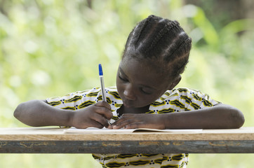 Education for Africa symbol: young black child writing down some notes during class outdoors. She's...