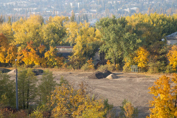 Construction site and autumn trees