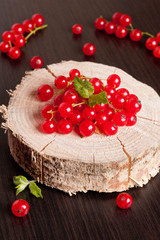 red currants on a black table, close up